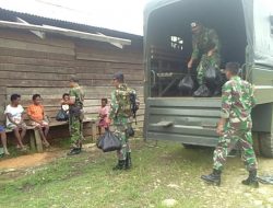 Yonif 725/WRG Berbagi Kebahagiaan Dengan Warga Dalam Suasana Lebaran
